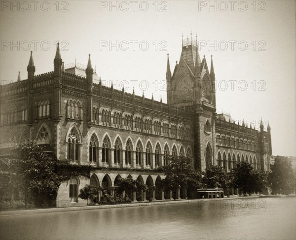 The High Court in Calcutta. Calcutta's neo-Gothic High Court, built between 1862 and 1872, and designed by Walter Granville who modelled it on the town hall at Ypres, Belgium. The expanse of water in the foreground is a swimming pool belonging the recently inaugurated Calcutta Swimming Club. Calcutta (Kolkata), India, circa 1890. Kolkata, West Bengal, India, Southern Asia, Asia.