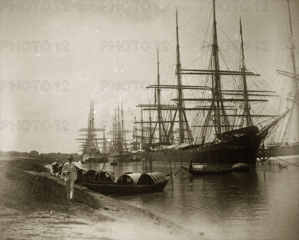 Vessels on the Hooghly River. A number of East Indiamen sailing ships are moored on the Hooghly River alongside several smaller sampans. Calcutta (Kolkata), India, circa 1887. Kolkata, West Bengal, India, Southern Asia, Asia.