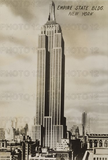 Empire State Building. The Art Deco-style Empire State Building towers over neighbouring buildings. New York, United States of America, circa 1942. New York, New York, United States of America, North America, North America .