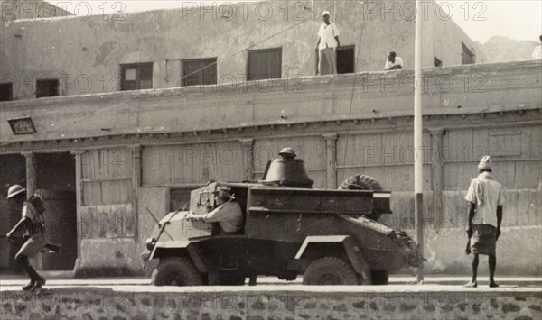 Armoured vehicle patrolling Aden during riots, 1947.. A light armoured vehicle is driven along a street in Aden, during the Arab riots that took place between 1-3 December 1947 in response to the United Nations Partition Plan for Palestine. Aden, Yemen, December 1947. Aden, Adan, Yemen, Middle East, Asia.