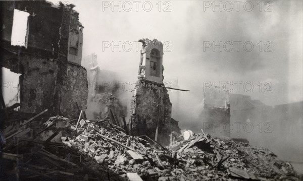 Aftermath of Arab riots in Aden, 1947. The smoking ruins of a building reduced to rubble in the Jewish quarter of Aden, during the Arab riots that took place between 1-3 December 1947 in response to the United Nations Partition Plan for Palestine. Aden, Yemen, December 1947. Aden, Adan, Yemen, Middle East, Asia.