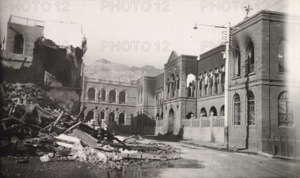 Street destroyed during Arab riots in Aden, 1947. View down a street in the Jewish quarter of Aden, which lies in ruins after the Arab riots that took place between 1-3 December 1947 in response to the United Nations Partition Plan for Palestine. Aden, Yemen, December 1947. Aden, Adan, Yemen, Middle East, Asia.