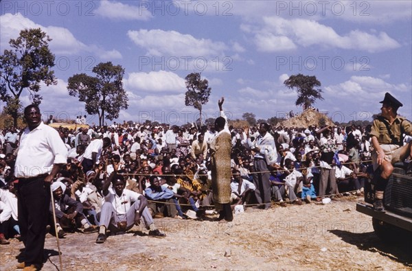 United National Independence Party rally. A member of the United National Independence Party waves to a crowd of supporters during a politcal rally. Kitwe, Northern Rhodesia (Zambia), circa 1962. Nkana-Kitwe, Copperbelt, Zambia, Southern Africa, Africa.