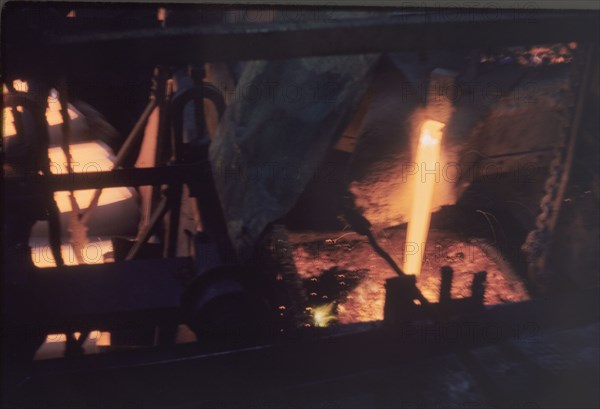 Pouring copper at Nkana-Kitwe mines. Copper is poured into a furnace during the refining process at the copper mines. Nkana-Kitwe, Northern Rhodesia (Zambia), circa 1962. Nkana-Kitwe, Copperbelt, Zambia, Southern Africa, Africa.