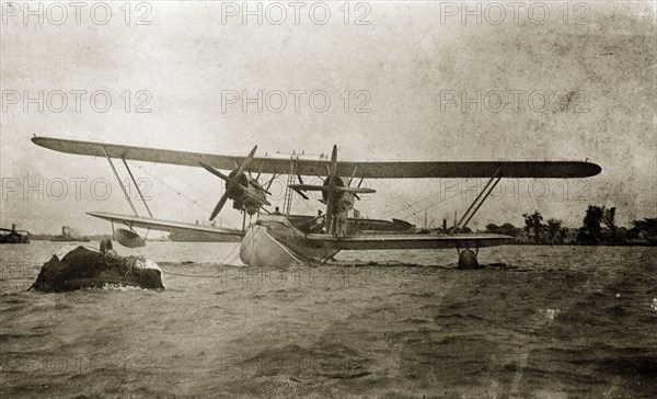 Flying boat, Nigeria. The flying boat 'Singapore', piloted by Sir Alan Cobham, is secured to a buoy in the harbour. Lagos, Nigeria, 1928., Lagos, Nigeria, Western Africa, Africa.