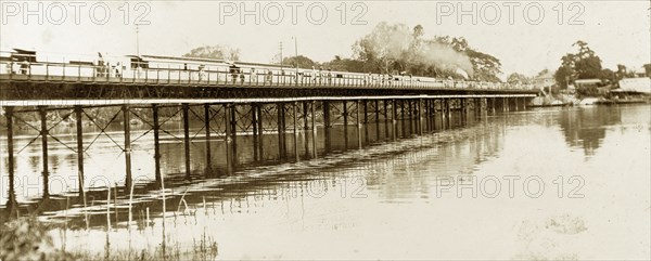 Denton Bridge, Nigeria. A steam train crosses the river over Denton Bridge. Ebute-Metta, Nigeria, circa 1925. Ebute-Metta, Lagos, Nigeria, Western Africa, Africa.