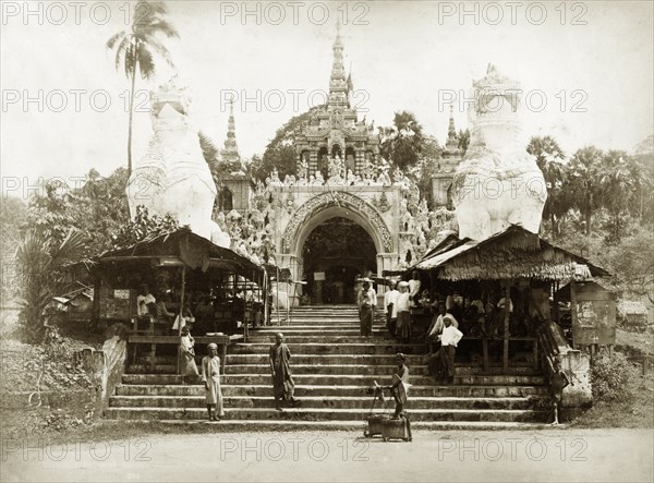 The Shwe Dagon Pagoda. Steps leading up to the main, southern entrance to the Buddist shrine of Shwe Dagon Pagoda, protected by two 'chenthe' (half-lion, half-dragon guardian figures). Rangoon (Yangon), Burma (Myanmar), circa 1885. Yangon, Yangon, Burma (Myanmar), South East Asia, Asia.