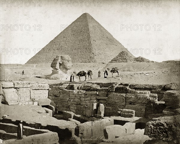 The Sphinx, circa 1900. South easterly view of the Giza plateau showing one of the pyramids and the statue of the Sphinx, at this point still buried up to its chest in sand. Giza, Egypt, circa 1900. Giza, Giza, Egypt, Northern Africa, Africa.