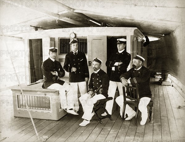 Officers aboard RIMS 'Elphinstone'. Group portrait of five uniformed officers posed on the deck of the RIMS 'Elphinstone'. India, circa 1900. India, Southern Asia, Asia.