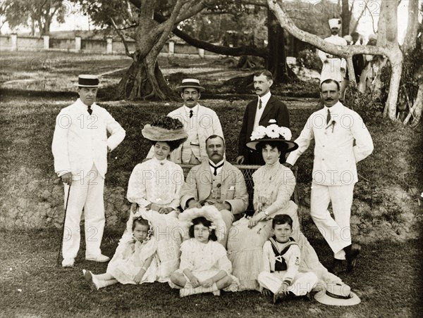 British group portrait. Outdoors portrait of a group of British men, women and children dressed in their best attire. Location unknown, circa 1900.