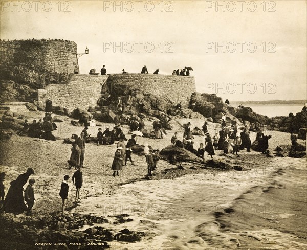 Beach at Weston-super-Mare. English families on holiday crowd the beach at Anchor Head. Weston-super-Mare, England, circa 1900. Weston-super-Mare, Somerset, England (United Kingdom), Western Europe, Europe .