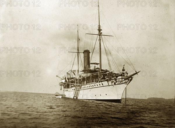 RIMS 'Investigator' at Sea. RIMS 'Investigator', a naval steamer, floats in anchorage at sea. An original caption suggests the ship may be carrying out a marine survey off the coast of India. Indian Ocean, circa 1900. India, Southern Asia, Asia.