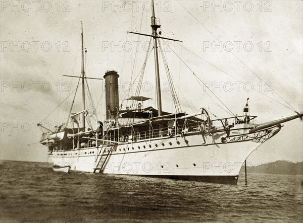 RIMS 'Investigator' at sea. RIMS 'Investigator', a naval steamer, floats in anchorage at sea. An original caption suggests the ship may be carrying out a marine survey off the coast of India. Indian Ocean, circa 1900. India, Southern Asia, Asia.