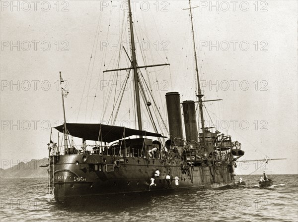 HMS 'Sirius' at sea. HMS 'Sirius', a naval steamer belonging to the Persian Gulf Operations Fleet. Probably the Persian Gulf, circa 1900., Middle East, Asia.