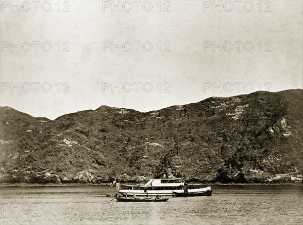 Armed launch 'Karanja'. Karanja', an armed launch boat belonging to the Persian Gulf Operations Fleet, floats off shore. Probably the Persian Gulf, circa 1900., Middle East, Asia.