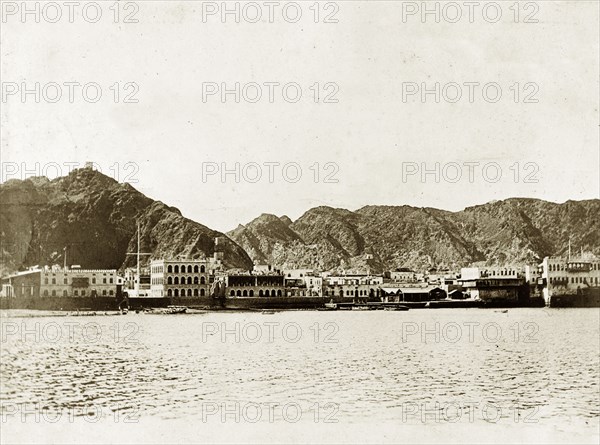 The harbour at Muscat. View of the harbour at Muscat taken from the anchorage point of a naval ship, a vessel that was probably part of the Persian Gulf Operations Fleet. Muscat, Oman, circa 1900. Muscat, Muscat, Oman, Middle East, Asia.