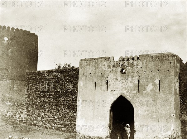 Muscat gateway. An ancient stone gateway leads from Muscat harbour into the town. Muscat, Oman, circa 1900. Muscat, Muscat, Oman, Middle East, Asia.