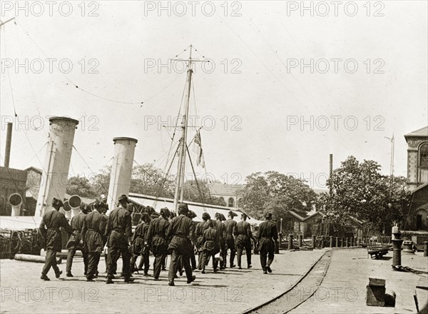 RIMS 'Minto' crew. Royal Indian Marine Service officers from RIMS 'Minto' embark on shore leave. Bombay (Mumbai), India, circa 1900. Mumbai, Maharashtra, India, Southern Asia, Asia.