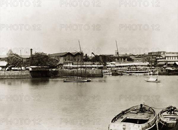 RIMS dockyard in Bombay. Boats moored in the harbour of a government dockyard belonging to the Royal Indian Marine Service. Bombay (Mumbai), India, circa 1900. Mumbai, Maharashtra, India, Southern Asia, Asia.