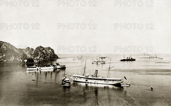Persian Gulf Operations Fleet. Ships belonging to the East India Squadron, part of the Persian Gulf Operations Fleet, float off shore. Arabian Sea, circa 1900., Southern Asia, Asia.