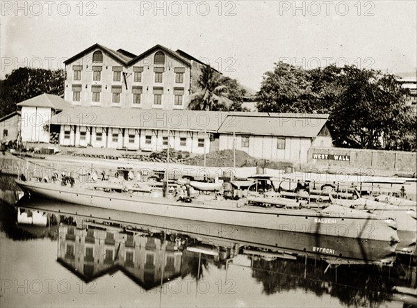A Bombay dockyard. Long barges moored in a dockyard. Bombay (Mumbai), India, circa 1900. Mumbai, Maharashtra, India, Southern Asia, Asia.
