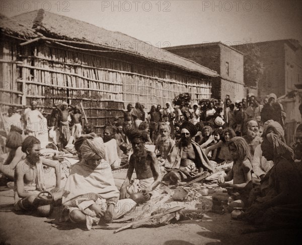 Hindy holy men, India. A group of Hindu holy men or fakirs sit cross-legged on the ground. Probably north India, circa 1890, India, Southern Asia, Asia.