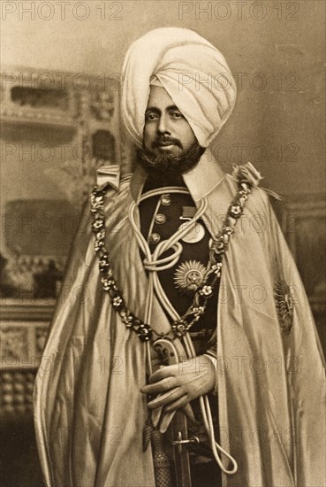 Maharajah of Jammu and Kashmir. Studio portrait of Sir Pratap Singh (1850-1925), Maharajah of Jammu and Kashmir, dressed in his robes for the Coronation Durbar at Delhi. India, circa 1902. India, Southern Asia, Asia.