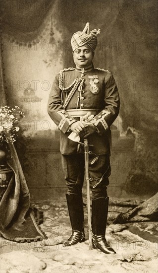 Maharajah of Gwalior. Studio portrait of Sir Madhava Rao Sindhia (1876-1925), Maharajah of Gwalior, dressed in his military uniform for the Coronation Durbar at Delhi. India, circa 1902. India, Southern Asia, Asia.