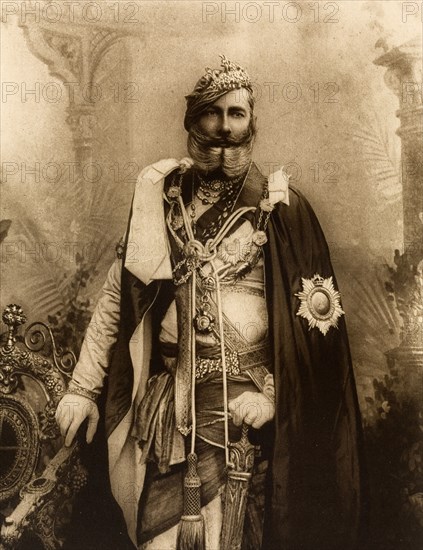 Maharajah of Orchha. Studio portrait of Sir Pratap Singh (1854-1930), Maharajah of Orchha, dressed in his robes for the Coronation Durbar at Delhi. India, circa 1902. India, Southern Asia, Asia.