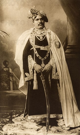 Maharajah of Kolhapur. Studio portrait of Sir Shahaji Chhatrapati (1875-1922), Maharajah of Kolhapur, dressed in his robes for the Coronation Durbar at Delhi. India, circa 1902. India, Southern Asia, Asia.