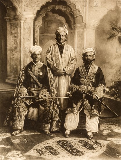 Chiefs dressed for the Coronation Durbar. Group studio portrait featuring Raja Sikander Khan of Nagar and the Mir of Hunza, dressed in ceremonial attire for the Coronation Durbar at Delhi. India, circa 1902. India, Southern Asia, Asia.