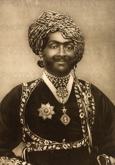 Nawab of Junagadh. Half-length studio portrait of Sir Rasul Khan (1858-1911), Nawab of Junagadh, finely dressed for the Coronation Durbar at Delhi. India, circa 1902. India, Southern Asia, Asia.