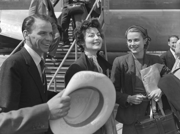Gardner, Sinatra and Kelly. Hollywood film stars Frank Sinatra, Ava Gardner and Grace Kelly share a joke on their arrival at Eastleigh airport. Both Gardner and Kelly were due to play lead roles in 'Mogambo', a John Ford film being shot on location in Kenya. Nairobi, Kenya, 7 November 1952. Nairobi, Nairobi Area, Kenya, Eastern Africa, Africa.