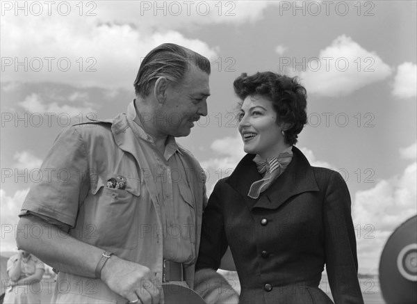 Clarke Gable and Ava Gardner. Hollywood film stars Clark Gable and Ava Gardner share a lighthearted chat on their arrival at Eastleigh airport. Both were due to play leading roles in 'Mogambo', a John Ford film being shot on location in Kenya. Nairobi, Kenya, 7 November 1952. Nairobi, Nairobi Area, Kenya, Eastern Africa, Africa.