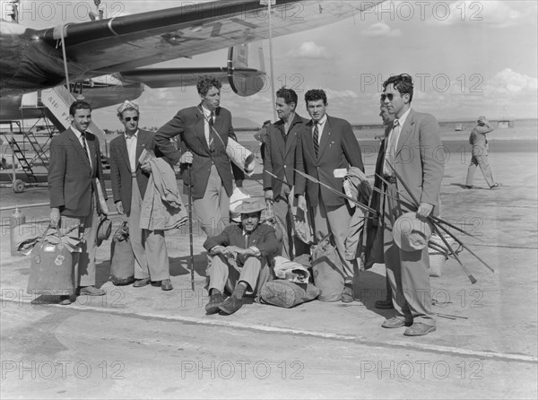 Arrival of a French athletics team. Members of a French athletics team wait on the runway with their luggage after their arrival at Eastleigh airport. Nairobi, Kenya, 9 November 1952. Nairobi, Nairobi Area, Kenya, Eastern Africa, Africa.