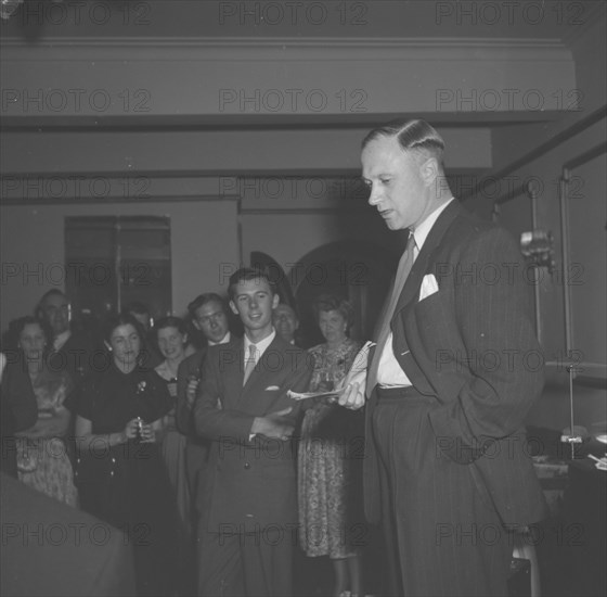 John Clarke's 21st birthday. Kenneth Meadows delivers a speech to an audience at John Clarke's 21st birthday party. Kenya, 8 November 1952. Kenya, Eastern Africa, Africa.