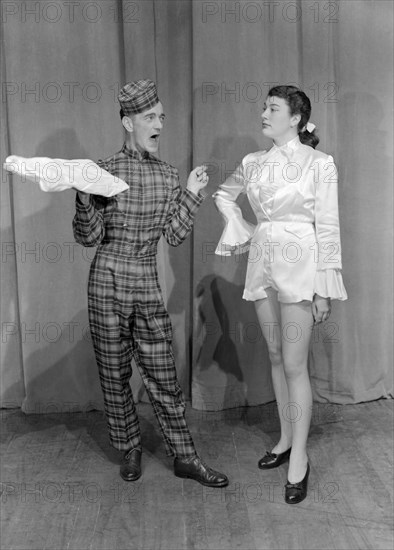 Cast of Cinderella. Two performers in character as Dandini and Buttons from Cinderella. Kenya, 12 December 1952. Kenya, Eastern Africa, Africa.