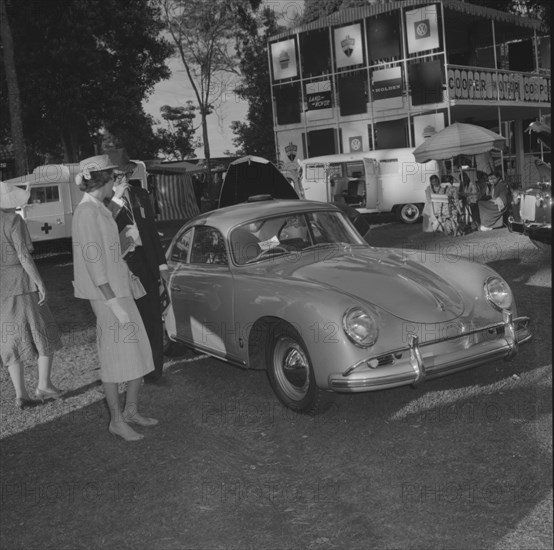 Cooper Motors at the Royal Show. A European couple consider a new car on display at the Cooper Motors stand at the Royal Show. Kenya, 25 September 1957. Kenya, Eastern Africa, Africa.