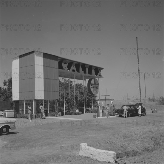 Caltex service station. A car is attended on the forecourt of an ultra-modern Caltex service station. Kenya 25 September 1957. Kenya, Eastern Africa, Africa.