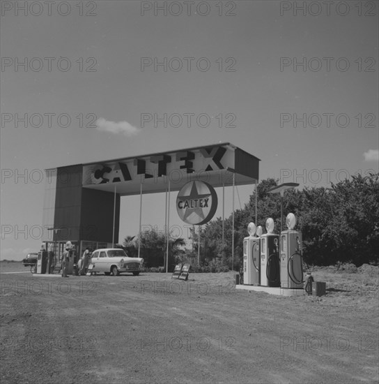 Caltex service station. A car is attended on the forecourt of an ultra-modern Caltex service station. Kenya 25 September 1957. Kenya, Eastern Africa, Africa.