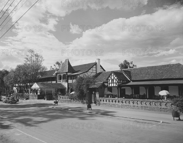 Norfolk Hotel, Nairobi. The half-timbered facade of the Norfolk Hotel, famously opened on 25 December 1904 with a Christmas morning cocktail party. Nairobi, Kenya, 13 October 1957. Nairobi, Nairobi Area, Kenya, Eastern Africa, Africa.