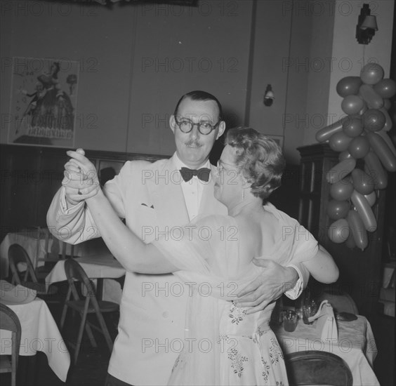 Northern Counties dance. A formally dressed couple, captured on the dance floor at the Northern Counties dance. Kenya, 2 November 1957. Kenya, Eastern Africa, Africa.