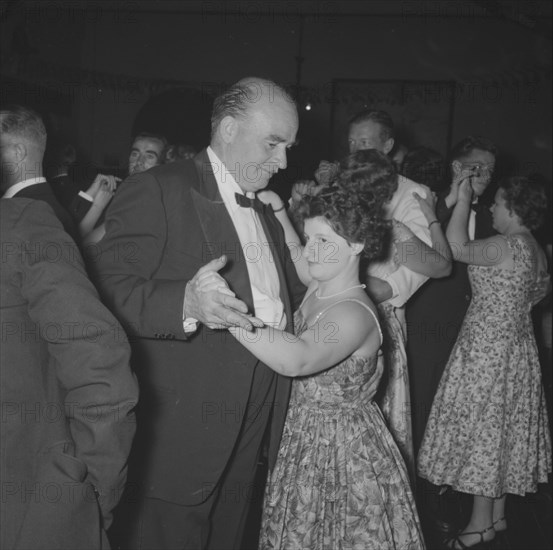 Northern Counties dance. A formally dressed couple, captured on the dance floor at the Northern Counties dance. Kenya, 2 November 1957. Kenya, Eastern Africa, Africa.