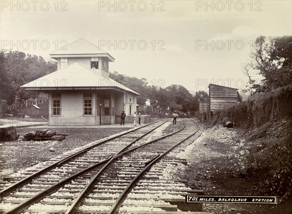Balaclava railway station. A group of men loiter on the platform and track outside Balaclava railway station. Balaclava, Jamaica, circa 1895. Balaclava, St Elizabeth, Jamaica, Caribbean, North America .