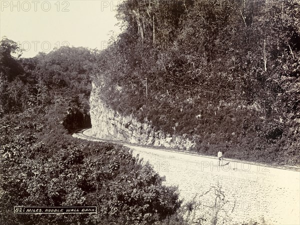 Railway track at Rubble Wall Bank. A newly completed railway track clings to the side of a mountain at Rubble Wall Bank. Jamaica, circa 1895. Jamaica, Caribbean, North America .
