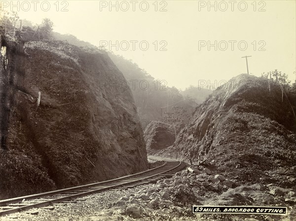 Track at 'Brocadoo Cutting'. A newly completed railway track winds around boulders at 'Brocadoo Cutting'. Jamaica, circa 1895. Jamaica, Caribbean, North America .