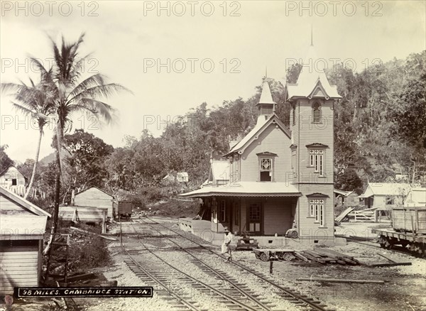 Cambridge railway station. A man crosses the tracks outside Cambridge railway station. Cambridge, Jamaica, circa 1895. Cambridge, St James (Jamaica), Jamaica, Caribbean, North America .