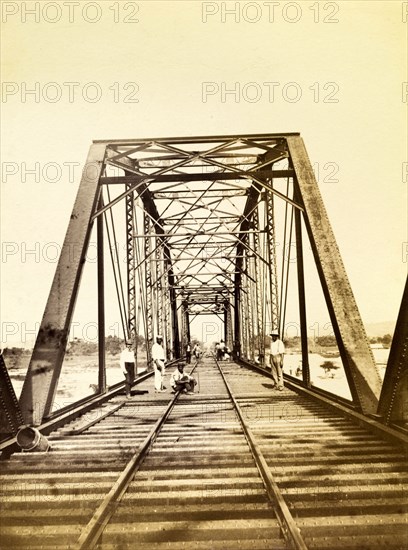 Construction workers on a bridge. Construction workers pictured on a newly completed railway bridge. Opening in 1896, this stretch of track was part of the Port Antonio extension line. Portland, Jamaica, circa 1895., Portland, Jamaica, Caribbean, North America .
