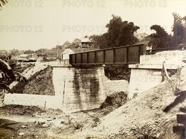 Railway viaduct under construction. A railway bridge under construction, spanning the gap across a shallow river bed. Jamaica, circa 1895. Jamaica, Caribbean, North America .