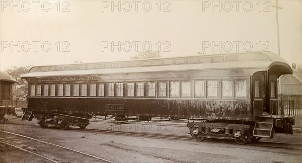Third class carriage, Jamaica. A Jamaica Railway third class carriage sits on rails at a siding. Jamaica, circa 1895. Jamaica, Caribbean, North America .